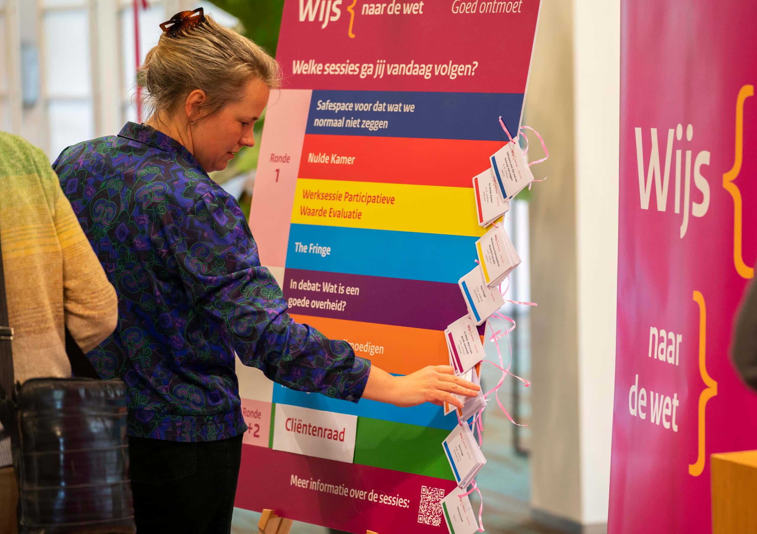 Deelnemers maken een keuze tussen de deelsessies